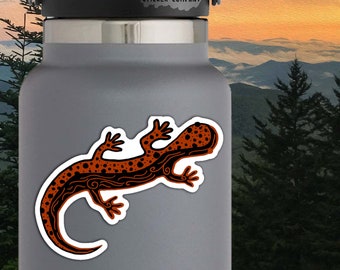 May include: Orange and black salamander sticker with a swirling pattern. The sticker is on a gray water bottle. Actual sticker size: 4" x 3".