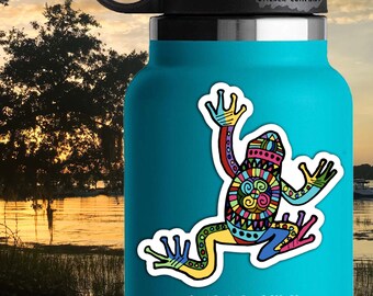 May include: Colorful patterned frog sticker on a blue water bottle. The sticker is 3.25 inches by 3 inches. The sticker company is called "Life Outside Sticker Company".