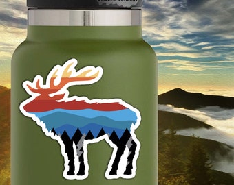 May include: A sticker featuring a silhouette of an elk with a mountain range and sunset sky design. The sticker is 3 inches by 3 inches and has a white border. The text "Life Outside Sticker Company" is visible in the top right corner of the image.