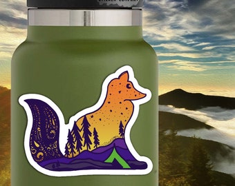May include: A sticker featuring a stylized fox with a mountain landscape inside its silhouette. The fox is orange and yellow with a starry sky inside. The mountain landscape is purple, blue, and green with a small green tent. The sticker is 3 inches by 3 inches.