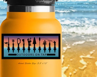 May include: A yellow water bottle with a black lid and a sticker that reads "OUTDOORS ON TAP." The sticker features silhouettes of outdoor activities. The sticker size is 3.5" x 1.5". The background shows a beach and ocean.