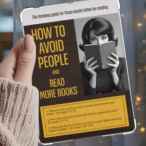 May include: A book titled "How to Avoid People and Read More Books" is held in front of a woman's face. The book's cover features a vintage image of a woman reading. The book's title is in large, bold letters. The book's subtitle is "The timeless guide for those who would rather be reading."