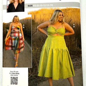 May include: A sewing pattern package featuring a woman in a lime green dress and a plaid dress. The package includes the text "knowME by mimiG" and "ALISHA GRACE". The size is K5 (8-10-12-14-16).