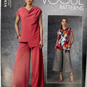 May include: Vogue Patterns sewing pattern featuring a cowl neck top and wide-leg pants. The main image shows a woman in a coral-colored outfit. The pattern includes sizes FS (16-18-20-22-24). The Vogue Patterns logo is visible.