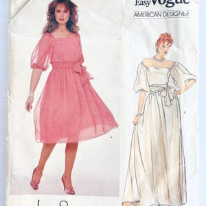 May include: Vintage sewing pattern for two dresses. The pattern is for a short, pink dress with a square neckline and a long, white dress with a sweetheart neckline. The pattern is from Very Easy Vogue, American Designer, and is designed by Jerry Silverman.