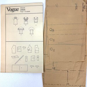May include: A vintage Vogue sewing pattern, English 2505, featuring illustrations of tops and pattern pieces. The pattern includes a brown paper envelope with size markings.