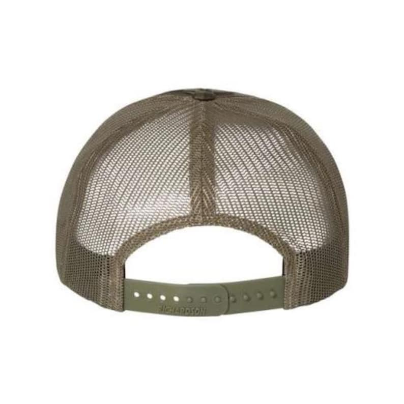 May include: Rear view of an olive green trucker cap. It has a mesh back and a curved peak. The adjustable strap is olive green and has the brand name "RICHARDSON" printed on it.