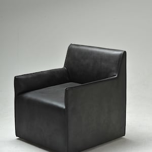 Melora armchair in black aniline leather