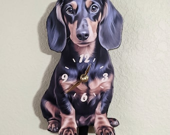 Wagging tail cat and dog wall clocks.
