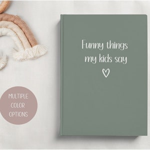 May include: A sage green journal with the text "Funny things my kids say" and a small heart symbol.