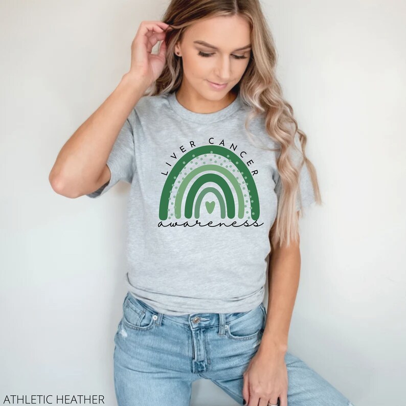 May include: A gray t-shirt with a green rainbow design and the text "Liver Cancer Awareness".