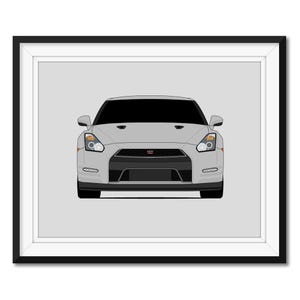 May include: A front view of a silver Nissan GT-R sports car. The car has black headlights and a black grille with the Nissan logo.