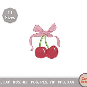 May include: Embroidered design of two red cherries with green stems and a pink bow. The image includes the text "11 Sizes" and the brand name "Carry Beauty". The design is suitable for various embroidery projects.