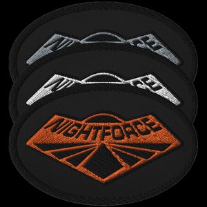 Broderad lapp med Night Force-motiv