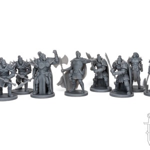 May include: A collection of gray miniature figurines of warriors and soldiers, each posed with weapons such as axes, spears, and swords. The figures are on circular bases, and the overall theme suggests a fantasy or historical setting.