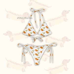 May include: A white ceramic mug with a black handle and the text "But First, Coffee" in a black, bold font. The mug is on a white surface. The mug is likely 11 ounces.