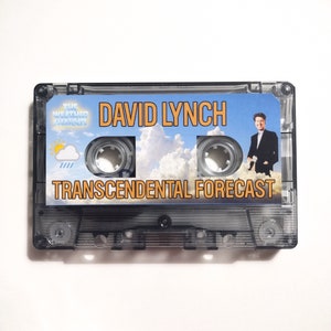 May include: A cassette tape with a blue sky and white clouds background. The text "DAVID LYNCH" and "TRANSCENDENTAL FORECAST" is printed in orange on the tape. A man in a suit is standing in the clouds. The text "THE WEATHER CHANNEL" is printed in a small box in the top left corner.