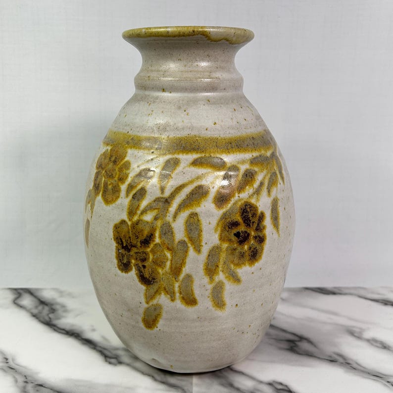 Vintage BAS studio pottery vase, handmade, light sand colour with brown and pale gold leaf and flower motif, 10.5" tall, signed, high-quality glaze.