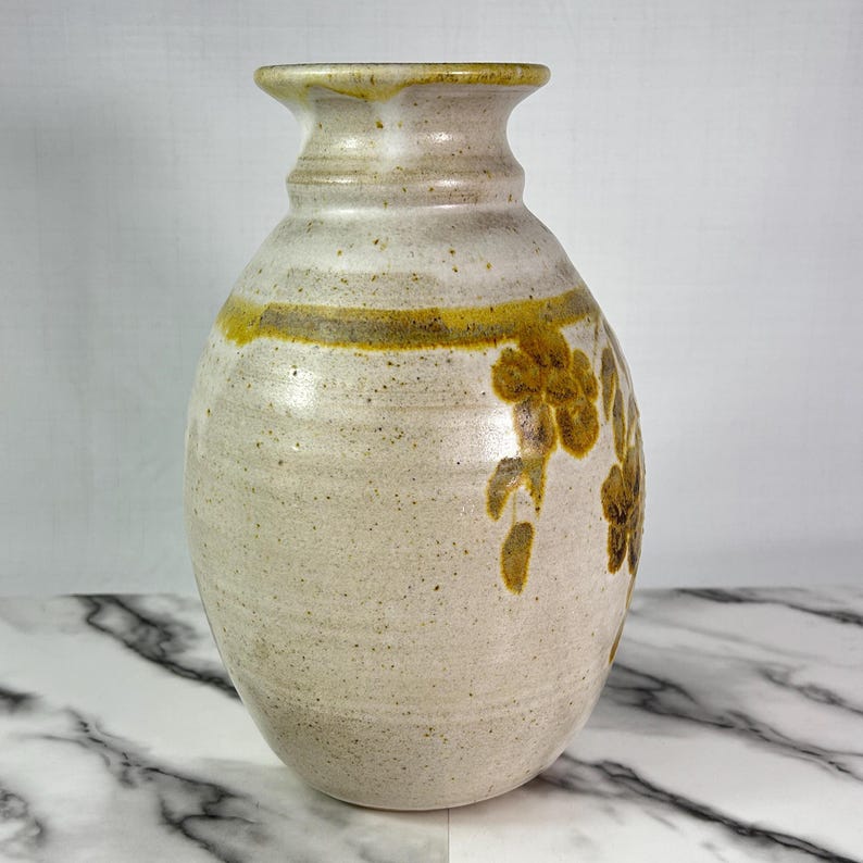 Vintage BAS studio pottery vase, handmade, light sand colour with brown and pale gold leaf and flower motif, 10.5" tall, signed, high-quality glaze.