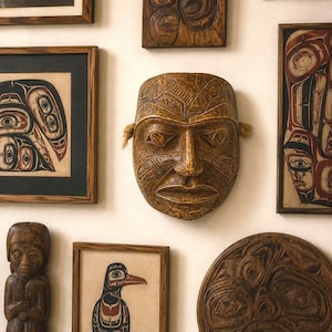 May include: A display of carved wooden artworks, featuring a central mask with detailed facial features and rope attachments. The mask is surrounded by framed prints and other carved wooden figures, all in shades of brown and tan.