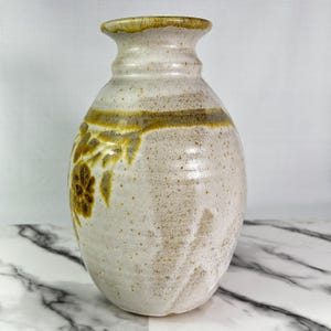 Vintage BAS studio pottery vase, handmade, light sand colour with brown and pale gold leaf and flower motif, 10.5" tall, signed, high-quality glaze.