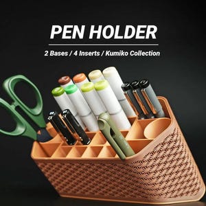 May include: A brown pen holder with a geometric pattern, containing pens, markers, and green scissors. The image displays the text "PEN HOLDER" and "2 Bases / 4 Inserts / Kumiko Collection".