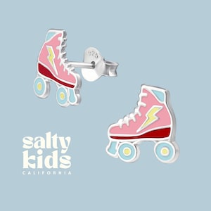 May include: Sterling silver roller skate earrings with pink, red, yellow, and blue enamel. The earrings feature a lightning bolt design.