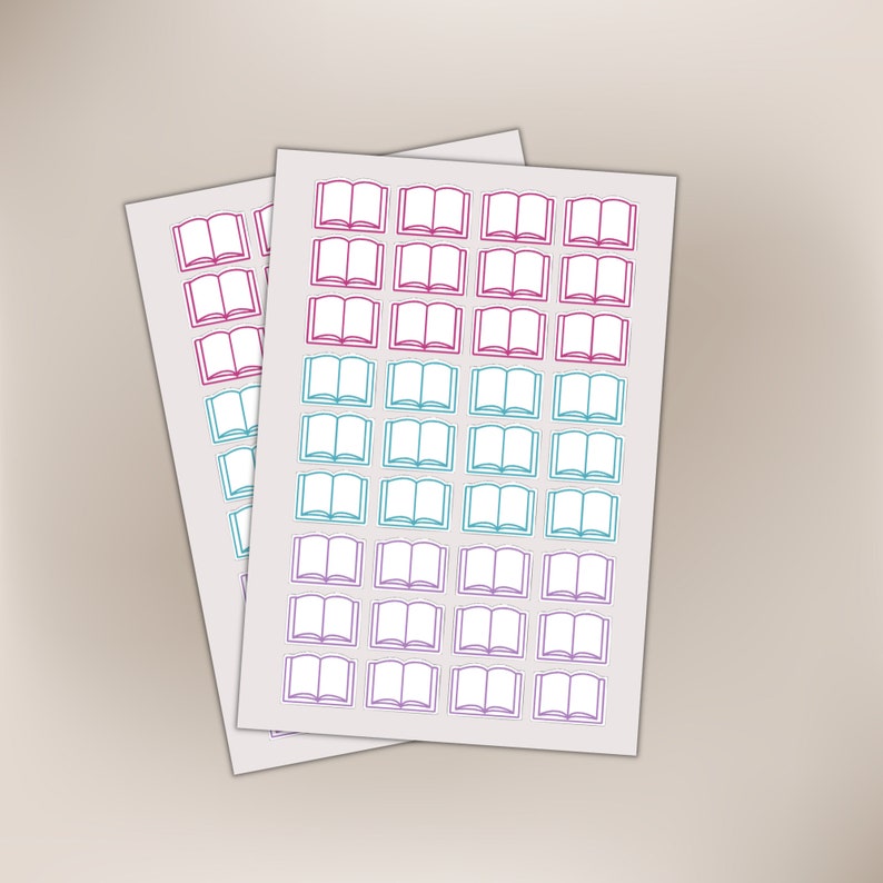 May include: Two sheets of stickers with open book outlines. The stickers are in a grid pattern. The top sheet has turquoise blue outlines and the bottom sheet has pink outlines.