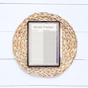 May include: A digital planner on a tablet with a brown wicker mat background. The planner is titled "Series Tracker" and has sections for "Series Title" and "Books Read".
