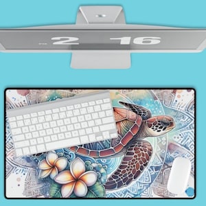 May include: A colourful mouse mat with a watercolour design of a sea turtle swimming in a circle of flowers and geometric patterns. A white keyboard and mouse are on the mouse mat.