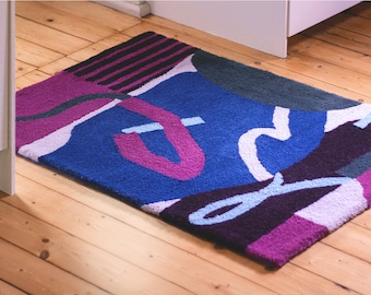 Geometric rug. 100% wool rug. Geometric shapes, lines.