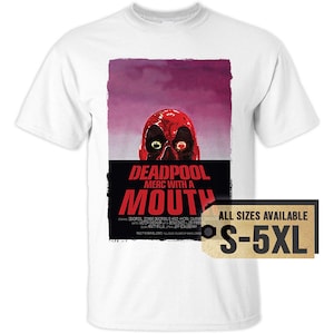 May include: White t-shirt featuring a Deadpool graphic. The graphic includes a red Deadpool head with the text "DEADPOOL MERC WITH A MOUTH". A tag indicates sizes S-5XL are available.