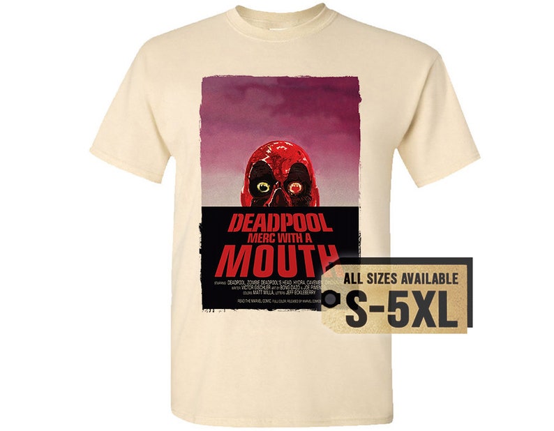 May include: Cream-colored t-shirt featuring a graphic of Deadpool's face with the text "DEADPOOL MERC WITH A MOUTH." The design includes a red skull and a purple background. The tag indicates sizes S-5XL.