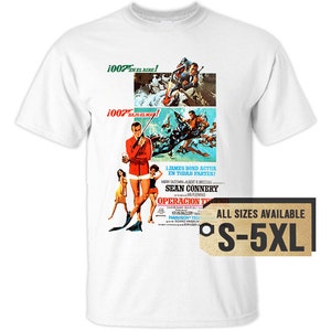 May include: A white t-shirt with a vintage movie poster design featuring Sean Connery as James Bond in the film "Thunderball". The poster features the text "1007 en el aire!" and "1007 Joelmay!" along with the tagline "I James Bond actua en todas partes!" and the title "Operacion Trueno". The poster is in Spanish and English. The t-shirt is available in sizes S-5XL.