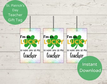 May include: Three printable gift tags with a rainbow background and glitter effect. The tags feature a green shamrock and the text "I'm so lucky to have you as my teacher".