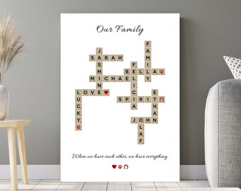 May include: A white canvas print with a crossword puzzle featuring the names Sarah, Michael, Bella, Ethan, John, and Lucky. The puzzle is titled "Our Family" and includes the words "love", "spirit", and "family". The print also includes the quote "When we have each other, we have everything".