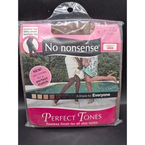 May include: A package of "No nonsense" brand pantyhose. The packaging is brown and pink, with the words "Perfect Tones" and "A Shade for Everyone." The package also states "control top, silky sheer, spandex leg." The pantyhose are mocha sheer toe, size B.