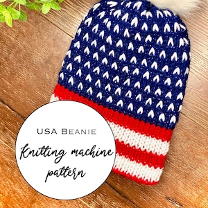 May include: A blue and white knitted beanie with a red and white stripe at the bottom. The beanie has a white pom pom on top and is labeled "USA BEANIE Knitting machine pattern".