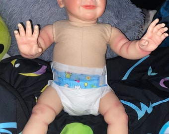 Vinyl reborn doll rooted hair cloth body