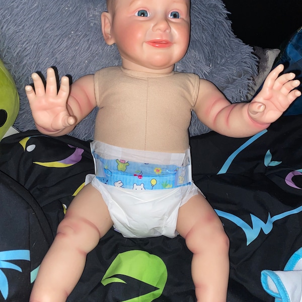 Vinyl reborn doll rooted hair cloth body