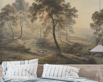 Puede incluir: Un mural paisajístico que presenta una serena escena de bosque con un río, árboles y una paleta de colores suaves y apagados. El mural está montado sobre una cama con ropa de cama y almohadas a rayas blancas y azules.