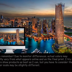 May include: An aerial view of a modern city skyline at dusk. The city is lit up with lights, and there are many tall buildings. A large body of water is in the foreground, and there are boats moored in the water.