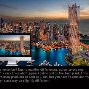 May include: An aerial view of a modern city skyline at dusk. The city is lit up with lights, and there are many tall buildings. A large body of water is in the foreground, and there are boats docked in the water.