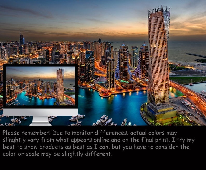 May include: An aerial view of a modern city skyline at dusk. The city is lit up with lights, and there are many tall buildings. A large body of water is in the foreground, and there are boats docked in the water.