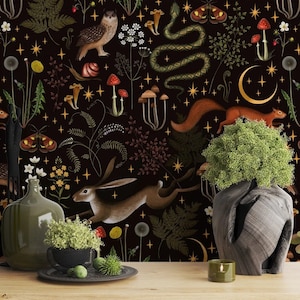 May include: A dark background with a repeating pattern of woodland creatures, plants, and stars. The pattern includes a snake, a rabbit, a squirrel, a mushroom, a fern, a dandelion, a moth, and a crescent moon. The pattern is in shades of brown, green, yellow, and white.