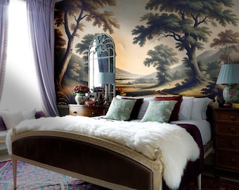 Op de afbeelding: Een slaapkamer met een grote landschapsmuurschildering op de muur, een wit bed met een pluche wit deken en een houten nachtkastje met een lamp.