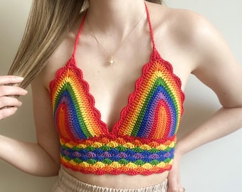 May include: A rainbow crochet halter top with a scalloped edge. The top is made with a variety of colors, including red, orange, yellow, green, blue, indigo, and violet.