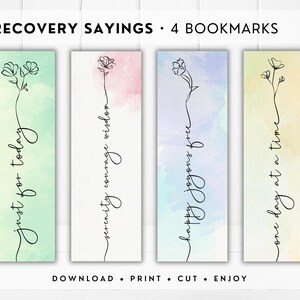 May include: Set of four bookmarks with watercolor backgrounds and inspirational quotes. Each bookmark features a unique floral line drawing and a different phrase: "just for today," "serenity courage wisdom," "happy joyous free," and "one day at a time."