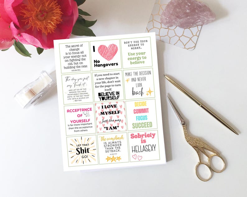 May include: A set of 12 colourful affirmation cards with motivational quotes and illustrations. The cards feature pink, yellow, blue, and green colours with white text. The quotes include "The secret of change is to focus all your energy not on fighting the old, but on building the new", "No Hangovers", "Don't use your energy to worry. Use your energy to believe", "Make the decision and never look back", "Believe in yourself", "I love myself just the way I am", "Decide, commit, focus, succeed", "The comeback is always stronger than the setback", "Let that shit go", and "Sobriety is hellasexy".