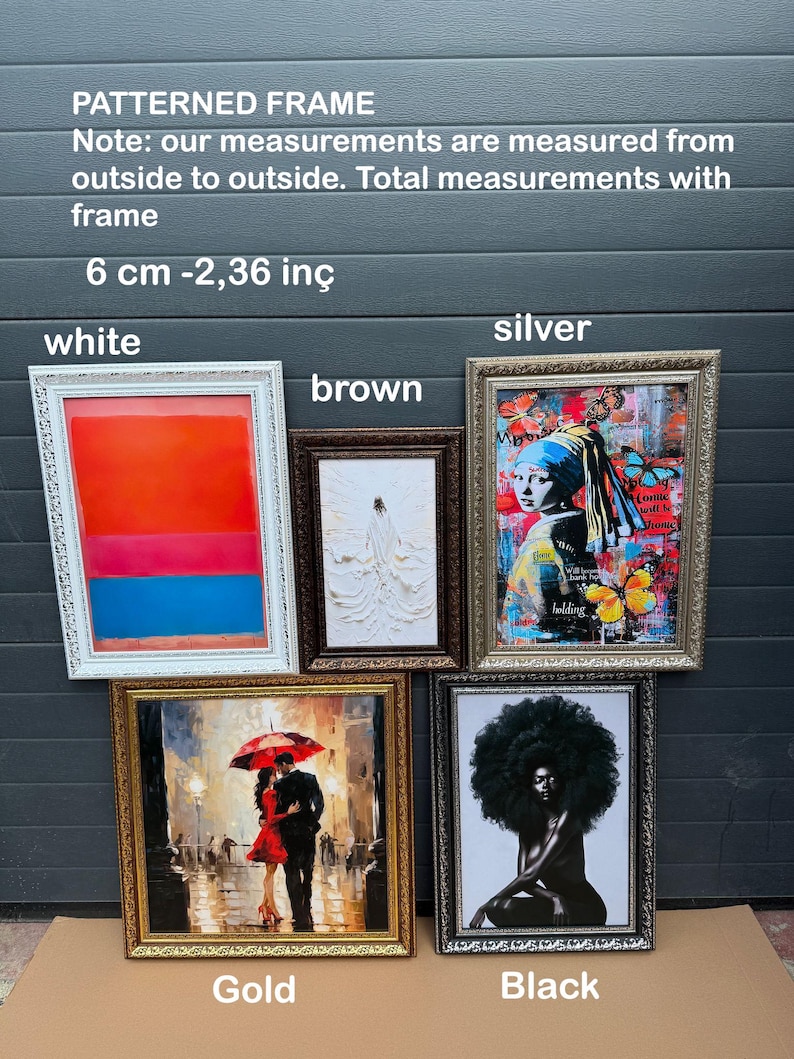 a display of framed art on a table